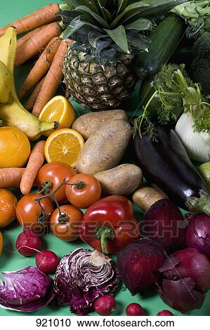 Arrangement of fruits and vegetables on a green background View Large Photo Image Stock Image - Arrangement of fruits and vegetables on a green background. Fotosearch
