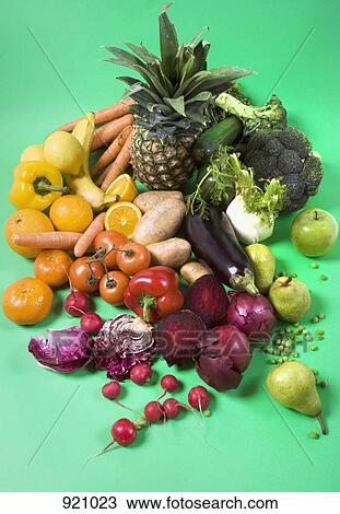 Arrangement of fruits and vegetables on a green background View Large Photo Image Stock Image - Arrangement of fruits and vegetables on a green background. Fotosearch
