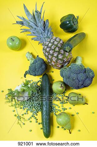 Arrangement of green fruits and vegetables on a yellow background View Large Photo Image Stock Image - Arrangement of green fruits and vegetables on a yellow background. Fotosearch