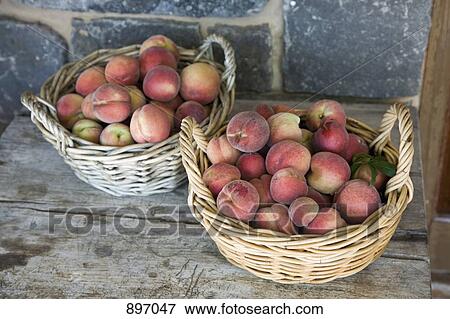 Stock Photo - Baskets of peaches. Fotosearch