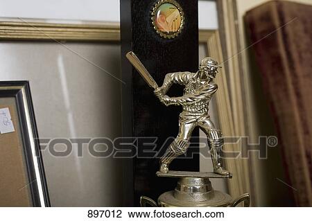 Stock Image - Detail of a cricket trophy. Fotosearch