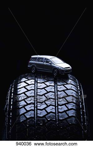 Stock Photograph - Detail of a toy car on a tire. Fotosearch