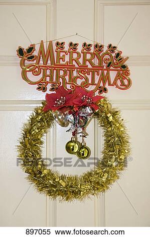 Stock Photography - Detail of Christmas decorations hanging on a door. Fotosearch