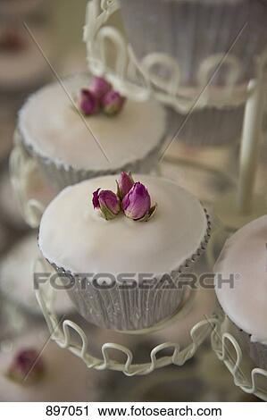 Detail of cupcakes on a stand View Large Photo Image Stock Image - Detail of cupcakes on a stand. Fotosearch