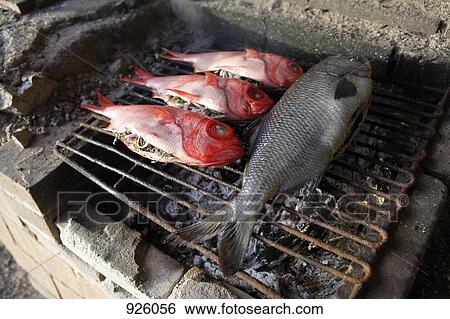 Detail of fish cooking on a barbeque grill View Large Photo Image Stock Photograph - Detail of fish cooking on a barbeque grill. Fotosearch