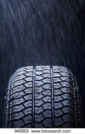 Detail of rain falling on a car tire View Large Photo Image Stock Image - Detail of rain falling on a car tire. Fotosearch