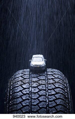 Detail of rain falling on a toy car on a tire View Large Photo Image Stock Image - Detail of rain falling on a toy car on a tire. Fotosearch