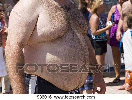 Detail of the stomach of an overweight man View Large Photo Image Stock Photograph - Detail of the stomach of an overweight man. Fotosearch