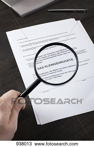Examining the fine print of a German rental contract with a magnifying glass View Large Photo Image Stock Image - Examining the fine print of a German rental contract with a magnifying glass. Fotosearch