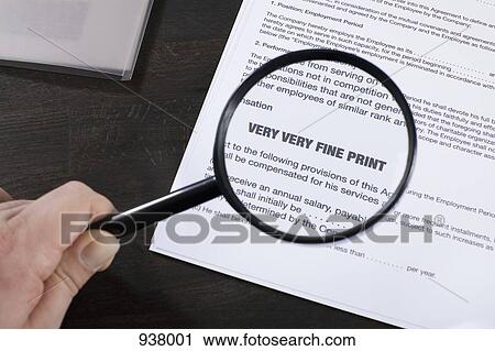 Examining the fine print of an employment agreement with a magnifying glass View Large Photo Image Stock Image - Examining the fine print of an employment agreement with a magnifying glass. Fotosearch
