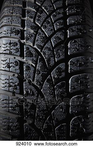 Stock Image - Extreme close up of a tire, full frame. Fotosearch