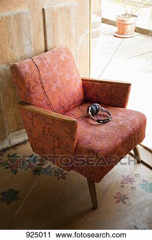 Stock Image - Headphones on an armchair. Fotosearch