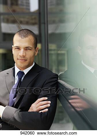 Portrait of a businessman with his arms crossed View Large Photo Image Stock Image - Portrait of a businessman with his arms crossed. Fotosearch