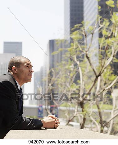Stock Image - Portrait of a contemplative businessman. Fotosearch
