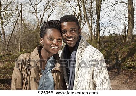 Portrait of a young couple in nature View Large Photo Image Stock Photograph - Portrait of a young couple in nature. Fotosearch