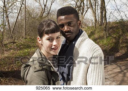 Portrait of a young couple in nature View Large Photo Image Stock Photography - Portrait of a young couple in nature. Fotosearch