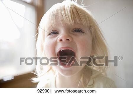 Portrait of a young girl laughing View Large Photo Image Stock Image - Portrait of a young girl laughing. Fotosearch