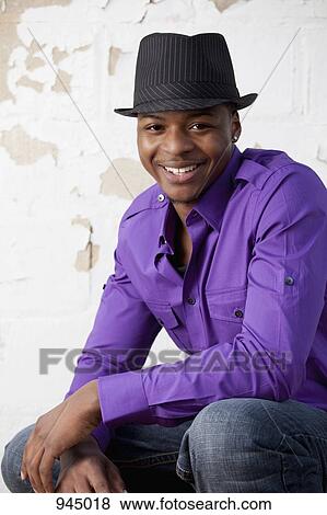 Stock Photo - Portrait of a young man smiling. Fotosearch