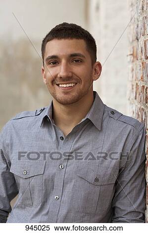 Portrait of a young man smiling View Large Photo Image Stock Photography - Portrait of a young man smiling. Fotosearch