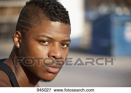 Portrait of a young man View Large Photo Image Stock Photo - Portrait of a young man. Fotosearch