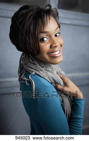 Portrait of a young woman smiling View Large Photo Image Stock Image - Portrait of a young woman smiling. Fotosearch