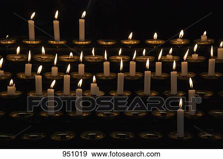 Rows of prayer candles View Large Photo Image Stock Photo - Rows of prayer candles. Fotosearch