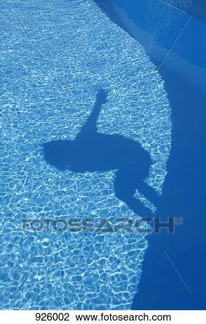 Shadow of a person jumping into a swimming pool View Large Photo Image Stock Image - Shadow of a person jumping into a swimming pool. Fotosearch