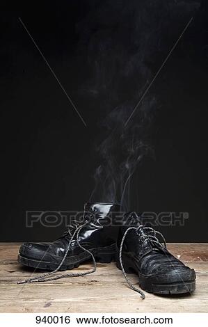 Smoke coming from leather boots View Large Photo Image Stock Photograph - Smoke coming from leather boots. Fotosearch