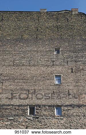 Stock Photo - The brick wall of a building. Fotosearch