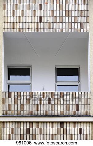 The windows and balcony of an apartment, low angle view View Large Photo Image Stock Photograph - The windows and balcony of an apartment, low angle view. Fotosearch