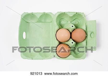 Three brown eggs in an egg carton View Large Photo Image Stock Image - Three brown eggs in an egg carton. Fotosearch