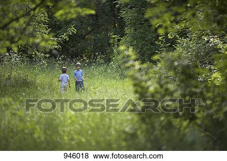 Stock Photo - Two young boys outdoors in summer. Fotosearch
