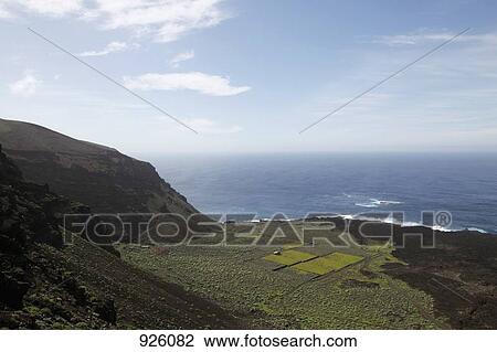View of a coastal landscape and the sea, El Hierro, Spain View Large Photo Image Stock Image - View of a coastal landscape and the sea, El Hierro, Spain. Fotosearch