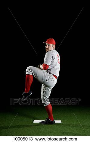 A baseball player winding up to pitch View Large Photo Image Stock Image - A baseball player winding up to pitch. Fotosearch