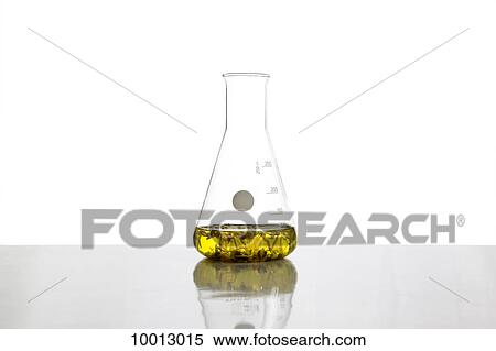 A beaker filled with fluid and plants View Large Photo Image Stock Photography - A beaker filled with fluid and plants. Fotosearch