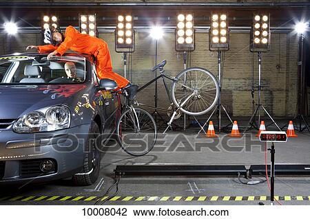 A crash test dummy on a bicycle crashing into a car View Large Photo Image Stock Image - A crash test dummy on a bicycle crashing into a car. Fotosearch