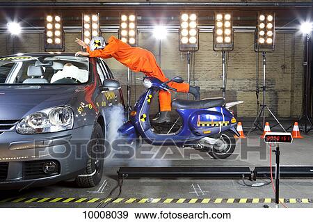 Stock Photo - A crash test dummy on a scooter crashing into a car. Fotosearch