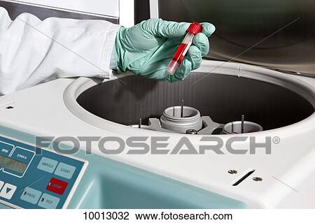A lab technician putting a vial of blood into a centrifuge, close-up of hands View Large Photo Image Stock Image - A lab technician putting a vial of blood into a centrifuge, close-up of hands. Fotosearch