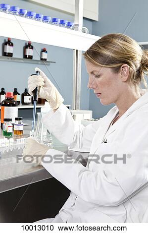 A lab technician using a pipette to put a sample into a test tube View Large Photo Image Stock Image - A lab technician using a pipette to put a sample into a test tube. Fotosearch