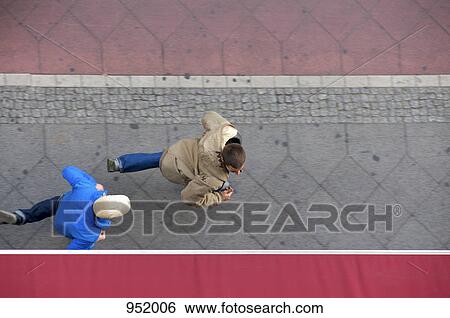 A man chasing his friend View Large Photo Image Stock Photograph - A man chasing his friend. Fotosearch