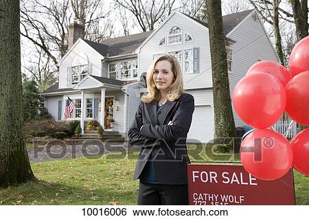 A real estate agent standing by a FOR SALE sign View Large Photo Image Stock Photograph - A real estate agent standing by a FOR SALE sign. Fotosearch