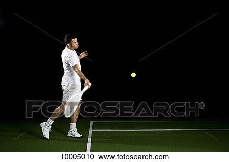A tennis player about to a hit a ball, studio shot, portrait View Large Photo Image Stock Image - A tennis player about to a hit a ball, studio shot, portrait. Fotosearch