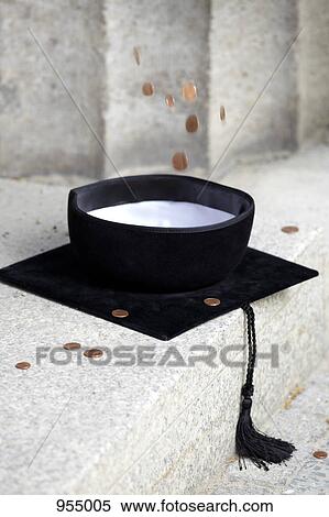 Copper coins falling into mortarboard View Large Photo Image Stock Photography - Copper coins falling into mortarboard. Fotosearch