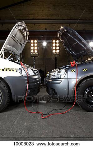 Two crash test cars with jumper cables View Large Photo Image Stock Image - Two crash test cars with jumper cables. Fotosearch