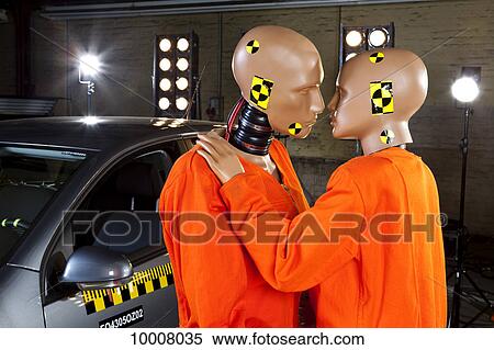 Two crash test dummies next to a car in a crash test laboratory about to kiss View Large Photo Image Stock Photography - Two crash test dummies next to a car in a crash test laboratory about to kiss. Fotosearch