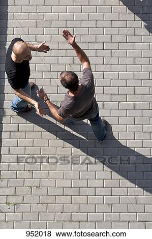 Two men arguing View Large Photo Image Stock Photo - Two men arguing. Fotosearch