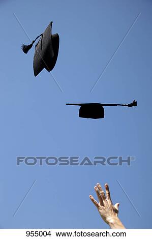 Two mortarboards being thrown View Large Photo Image Picture - Two mortarboards being thrown. Fotosearch