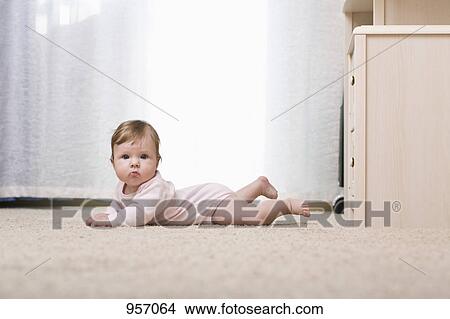 A baby looking at camera, portrait View Large Photo Image Picture - A baby looking at camera, portrait. Fotosearch