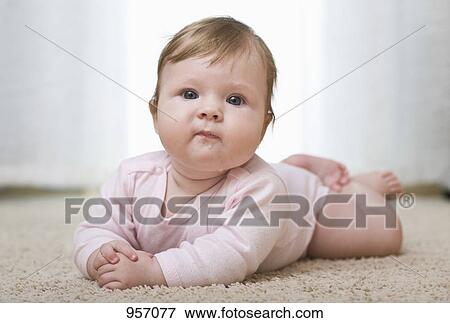 A baby looking at camera, portrait View Large Photo Image Stock Photo - A baby looking at camera, portrait. Fotosearch