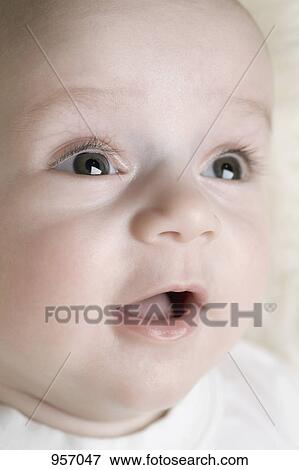 Stock Photo - A baby looking away. Fotosearch